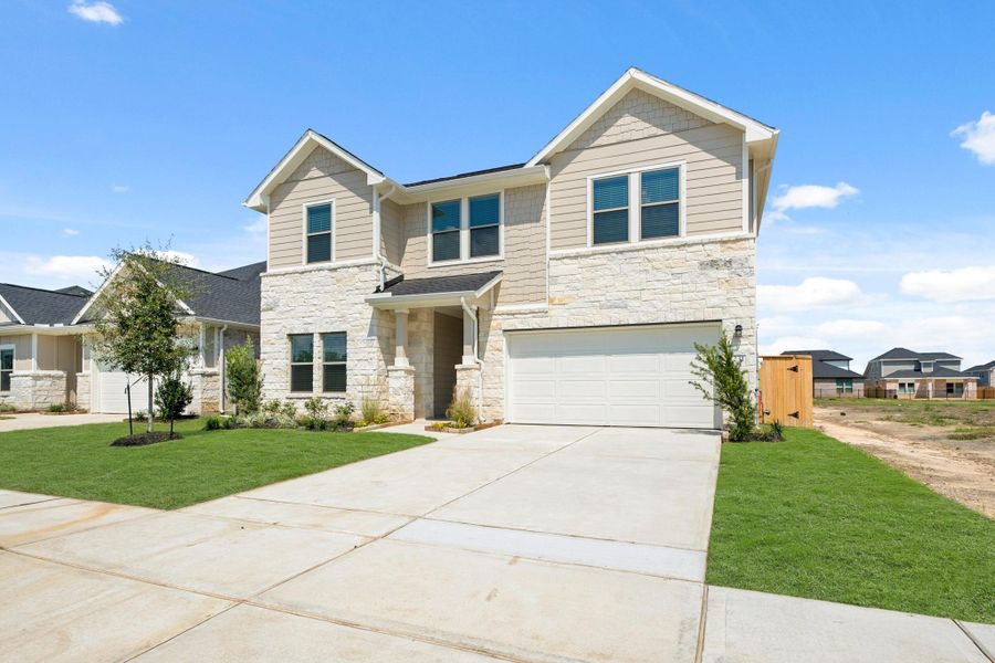 Front exterior of a new home in Laurel Landing, Alvin, TX, highlighting curb appeal (Image 13). Front exterior of a new home in Laurel Landing, Alvin, TX, highlighting curb appeal (Image 13).