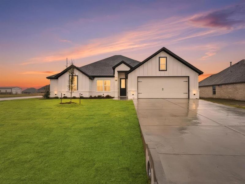 Front exterior of a new home in , Godley, TX, highlighting curb appeal (Image 2). Front exterior of a new home in , Godley, TX, highlighting curb appeal (Image 2).