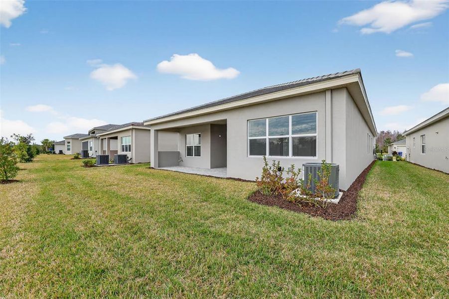 Exterior details and patio area of a home in Winding Ridge, Wesley Chapel (Image 23).