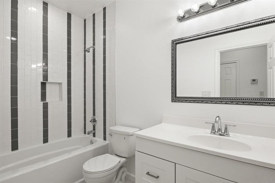 Full bathroom with shower / bath combination and vanity