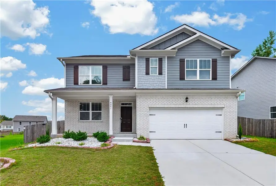Front exterior of a new home in Glen at Kensington, Lithia Springs, GA, highlighting curb appeal (Image 2). Front exterior of a new home in Glen at Kensington, Lithia Springs, GA, highlighting curb appeal (Image 2).