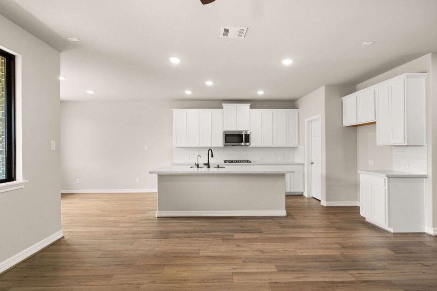 Kitchen featuring a large island and walk in pantry