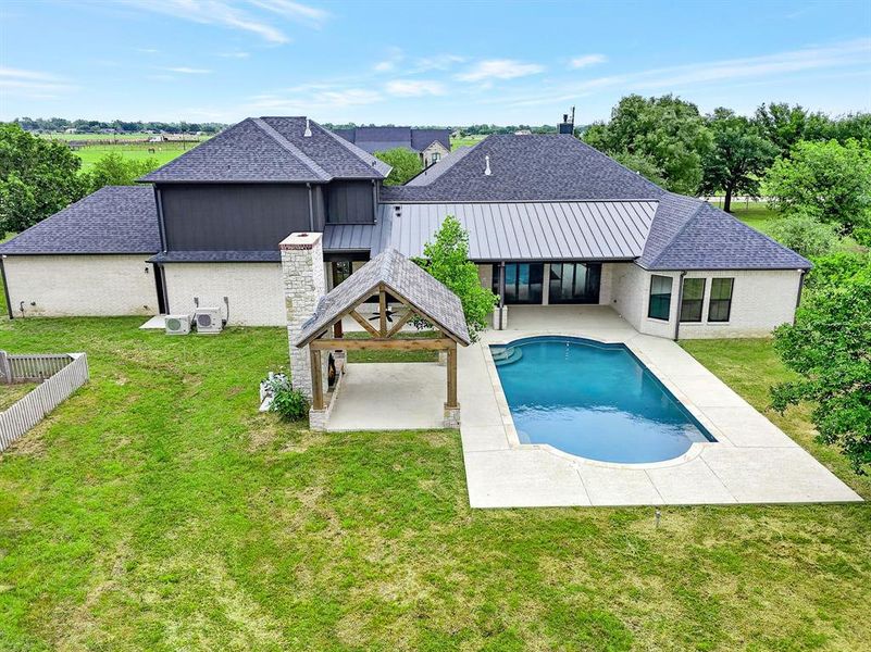 Large outdoor pool and outdoor cabana with built in fireplace Large outdoor pool and outdoor cabana with built in fireplace