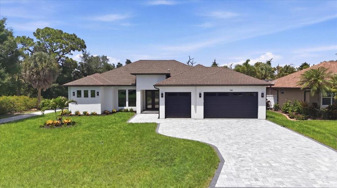 Front exterior of a new home in , Rotonda West, FL, highlighting curb appeal (Image 27).