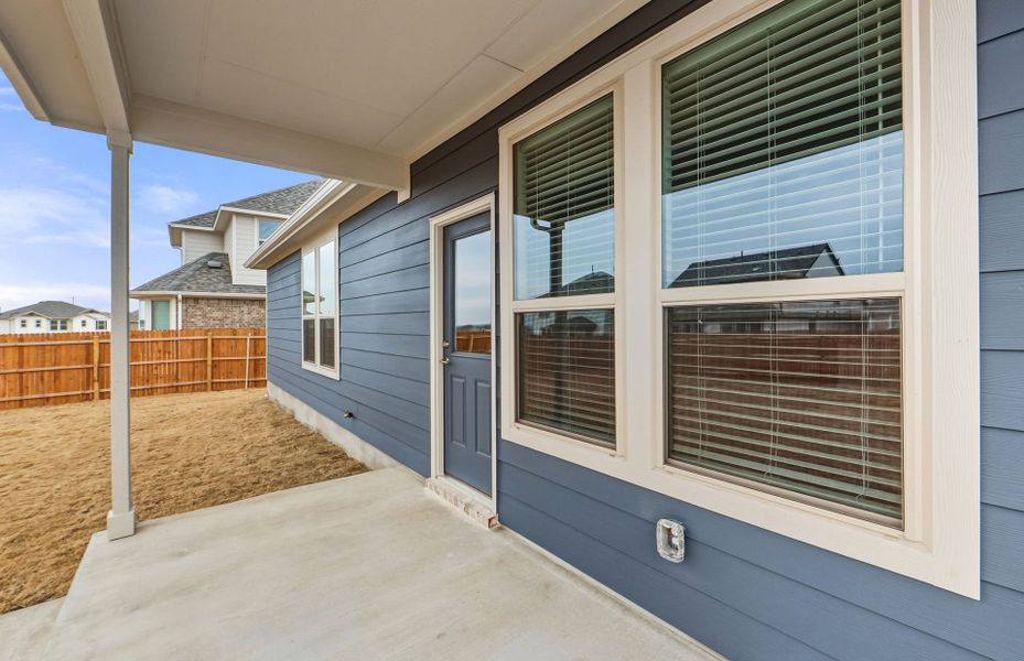 Exterior details and patio area of a home in Saddleback at Santa Rita Ranch, Liberty Hill (Image 26). Exterior details and patio area of a home in Saddleback at Santa Rita Ranch, Liberty Hill (Image 26).
