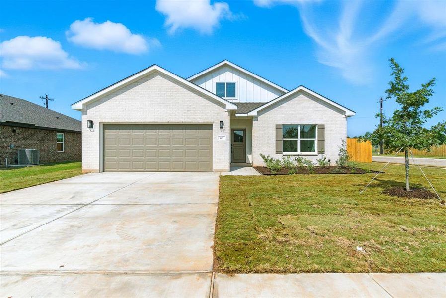 Front exterior of a new home in , Springtown, TX, highlighting curb appeal (Image 2).