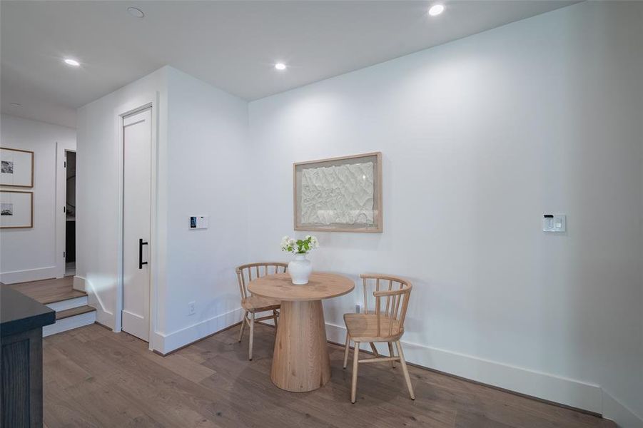 Dining area with wood-type flooring