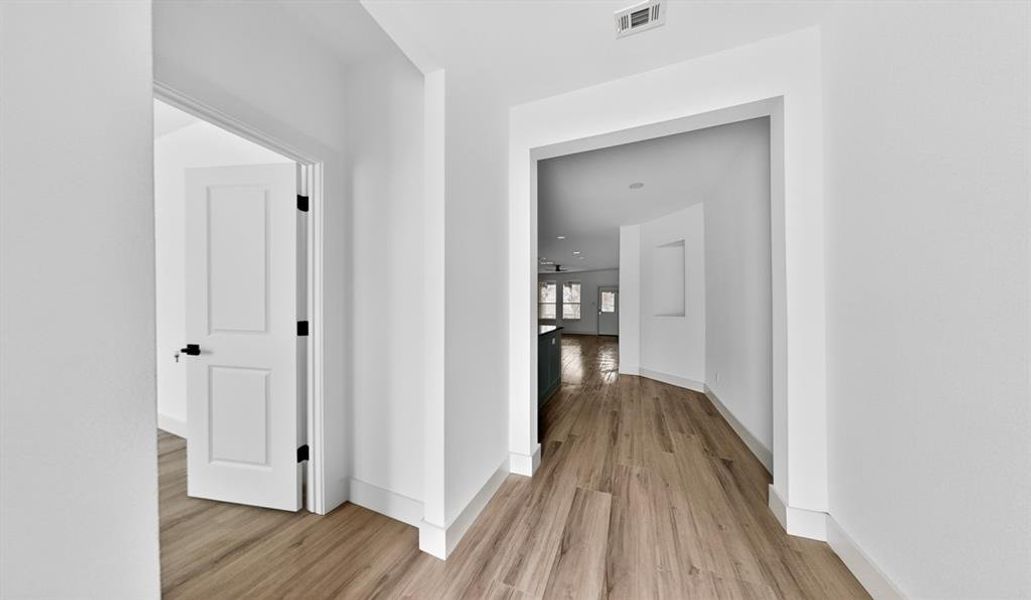 Hall with light wood-style floors