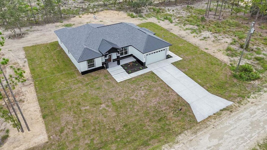 Front exterior of a new home in , Dunnellon, FL, highlighting curb appeal (Image 35). Front exterior of a new home in , Dunnellon, FL, highlighting curb appeal (Image 35).