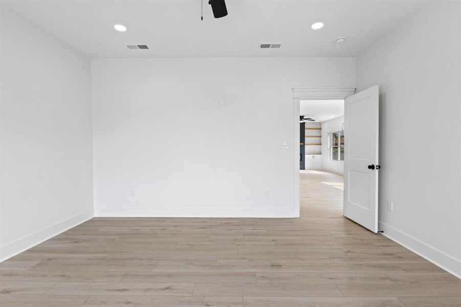 Empty room with recessed lighting, a ceiling fan, and light wood finished floors