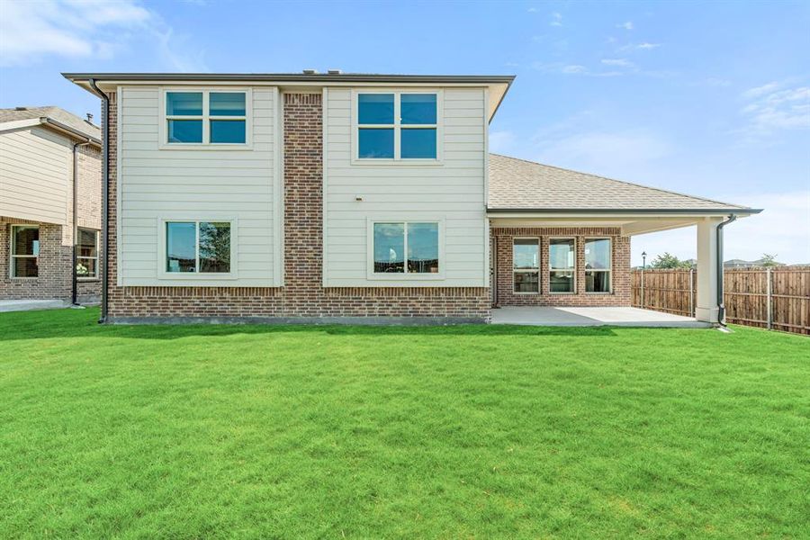 Exterior details and patio area of a home in West Crossing, Anna (Image 2). Exterior details and patio area of a home in West Crossing, Anna (Image 2).