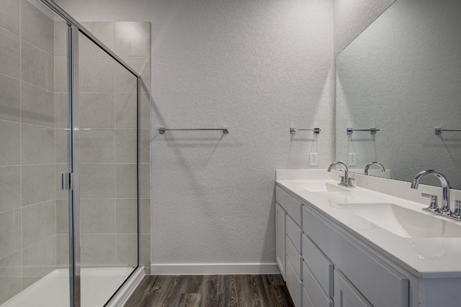 A bathroom with a glass shower.