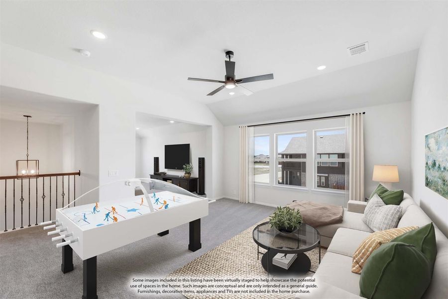Upstairs bonus room with air hockey table, sectional sofa, ceiling fan, and TV area near staircase landing Upstairs bonus room with air hockey table, sectional sofa, ceiling fan, and TV area near staircase landing