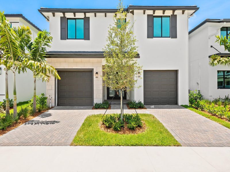 Front exterior of a new home in Marina Landings, Fort Lauderdale, FL, highlighting curb appeal (Image 2). Front exterior of a new home in Marina Landings, Fort Lauderdale, FL, highlighting curb appeal (Image 2).