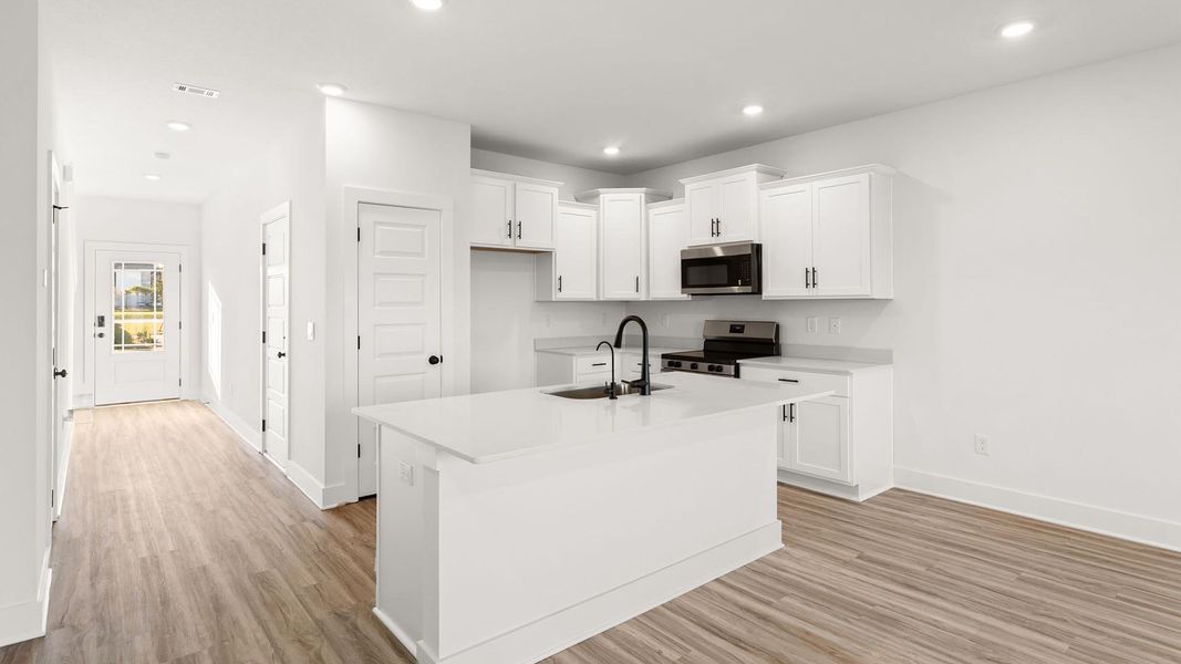 Furnished interior view inside a new home in Colonial East Townhomes, Panama City Beach (Image 7).