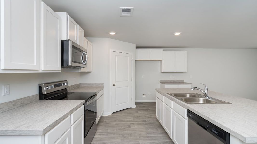Representative furnished interior of a home built from the CALI by D.R. Horton in Jordanville Farms, Galivants Ferry (Image 6).