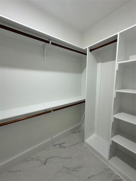 Spacious closet with marble finish flooring