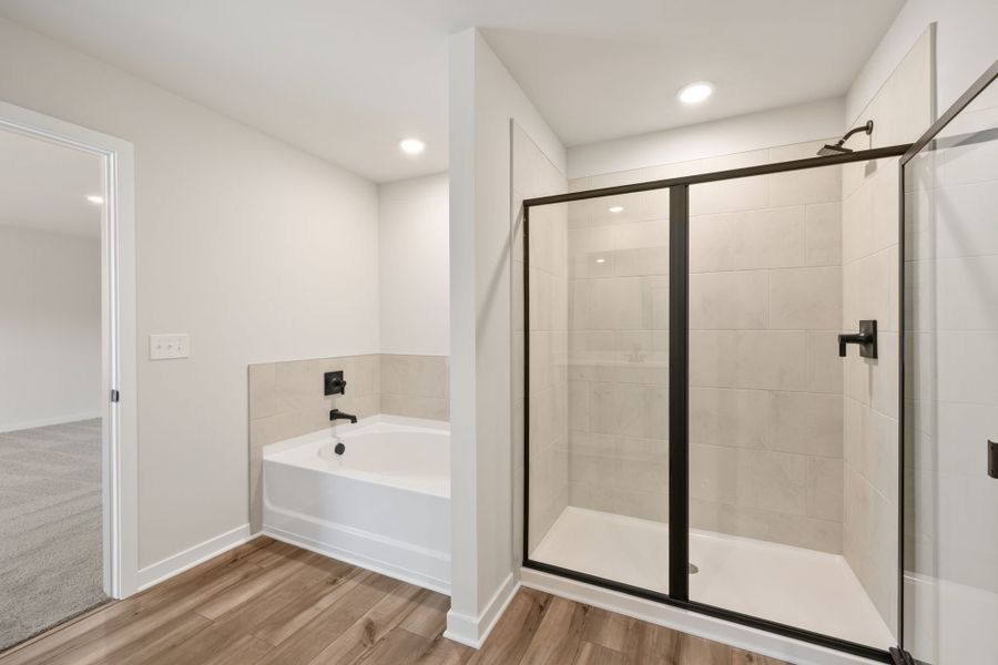 A bathroom with a glass shower. A bathroom with a glass shower.