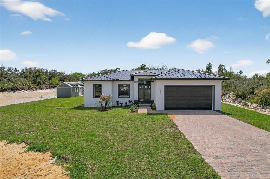 Front exterior of a new home in , Lake Placid, FL, highlighting curb appeal (Image 21).