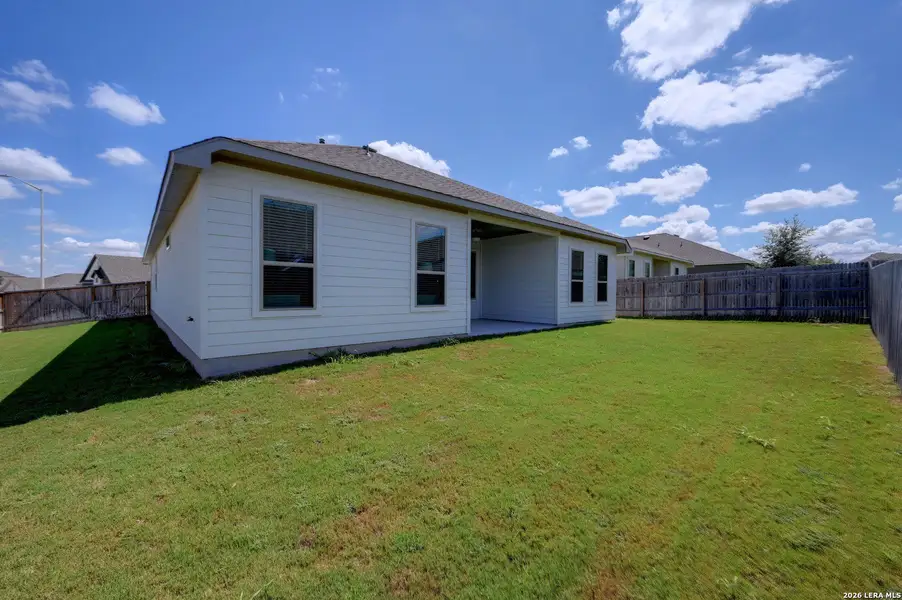 Exterior details and patio area of a home in The Parklands, Schertz (Image 26).