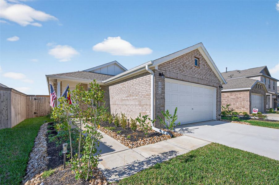 Front exterior of a new home in The Grand Prairie, Hockley, TX, highlighting curb appeal (Image 21).