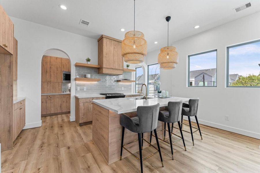 Spacious island with quartz countertops.