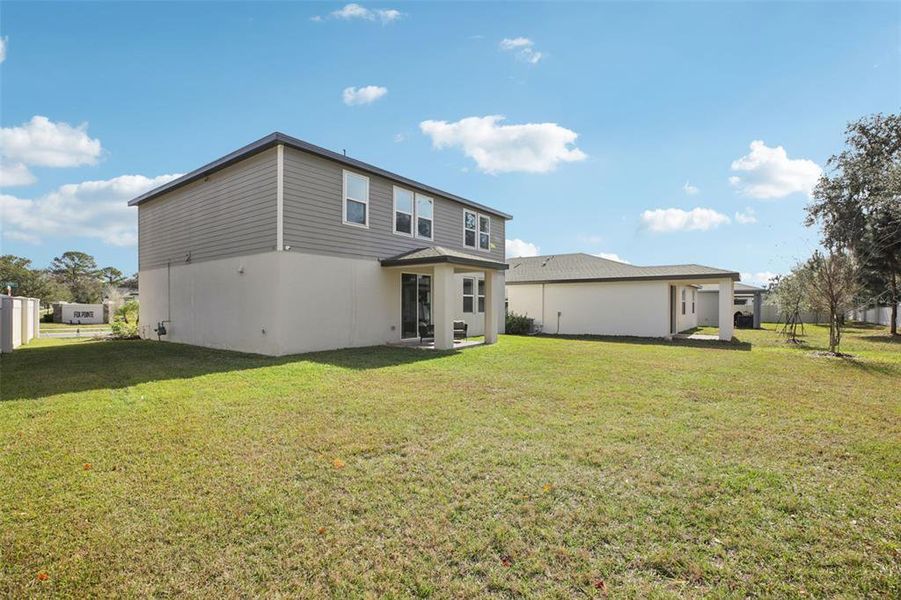 Exterior details and patio area of a home in Fox Pointe at Rivers Edge, Leesburg (Image 24).
