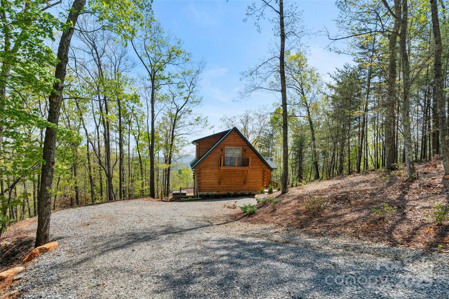Front exterior of a new home in , Lake Lure, NC, highlighting curb appeal (Image 1).
