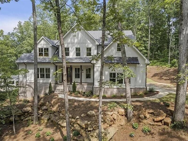 Front exterior of a new home in , Woodstock, GA, highlighting curb appeal (Image 25).