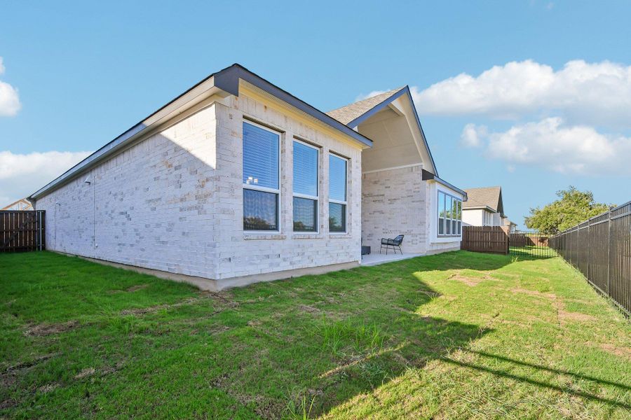 Exterior details and patio area of a home in Gregg Ranch, Marble Falls (Image 3).