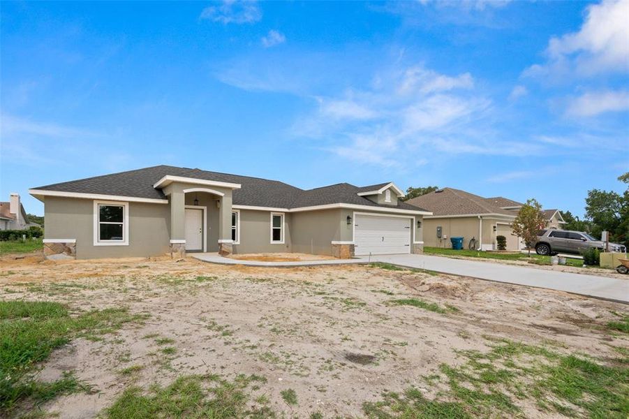 Front exterior of a new home in , Dade City, FL, highlighting curb appeal (Image 16).