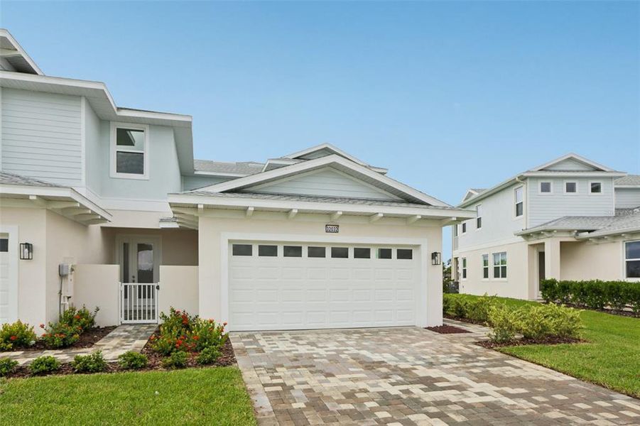 Front exterior of a new home in Lagoon Residences at Epperson, Wesley Chapel, FL, highlighting curb appeal (Image 23).