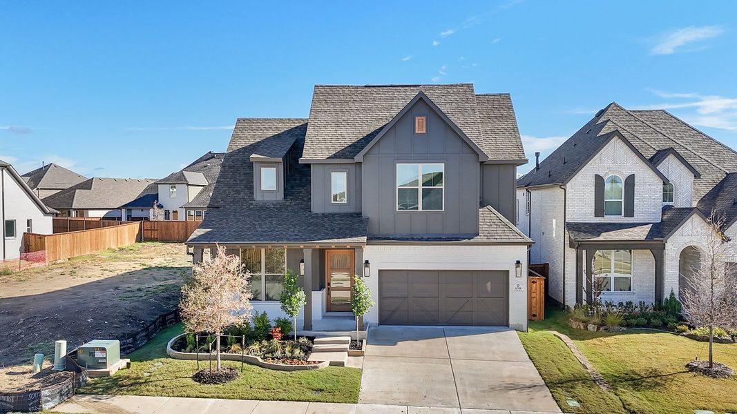 Front exterior of a new home in Aster Park, McKinney, TX, highlighting curb appeal (Image 26). Front exterior of a new home in Aster Park, McKinney, TX, highlighting curb appeal (Image 26).