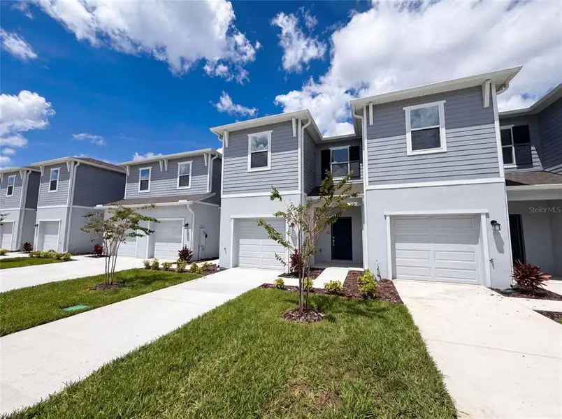 Front exterior of a new home in , Davenport, FL, highlighting curb appeal (Image 16). Front exterior of a new home in , Davenport, FL, highlighting curb appeal (Image 16).
