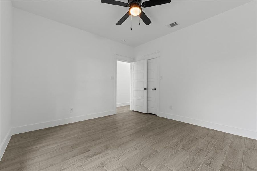 Spare room featuring light hardwood / wood-style flooring and ceiling fan