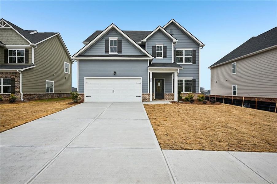 Front exterior of a new home in The Hills at Cedar Creek, Winder, GA, highlighting curb appeal (Image 21).