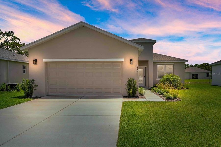 Front exterior of a new home in , Brooksville, FL, highlighting curb appeal (Image 2).
