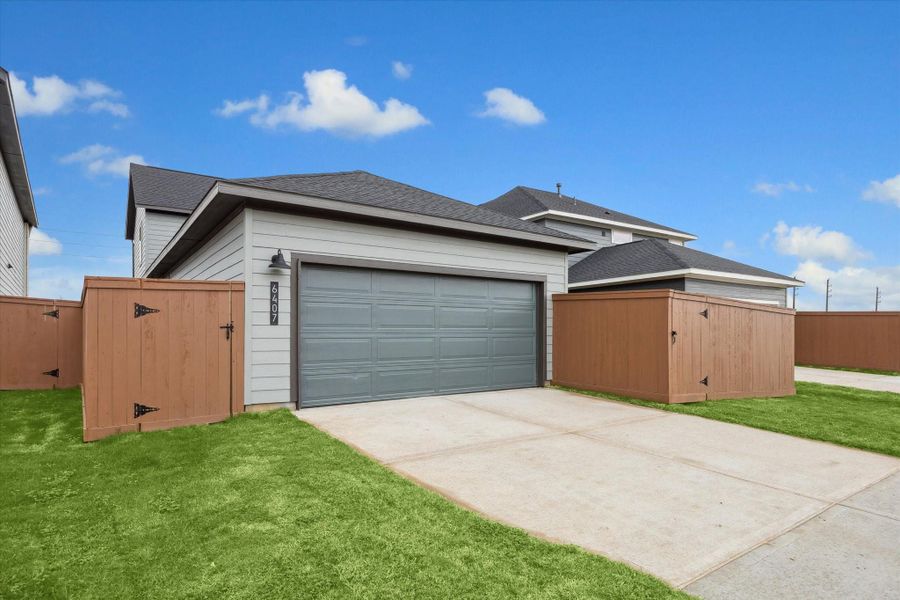 Front exterior of a new home in Elyson, Katy, TX, highlighting curb appeal (Image 2).