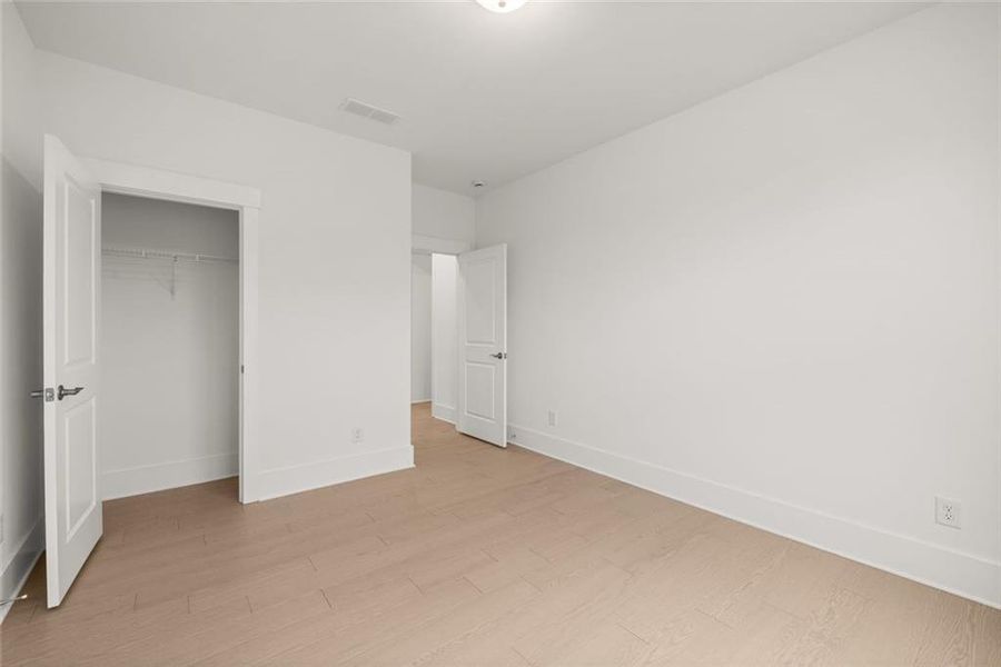 Spacious, unfurnished interior of a new home in Soleil Belmont Park, Canton (Image 42).