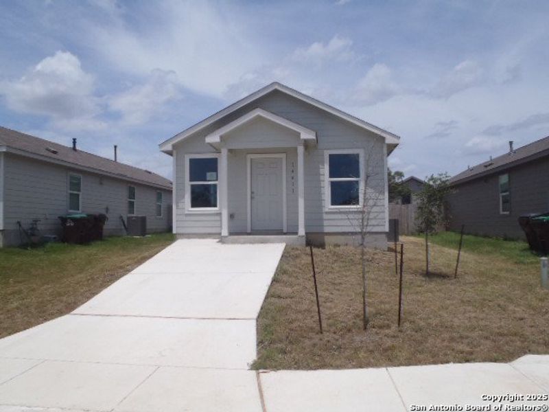 Front exterior of a new home in , San Antonio, TX, highlighting curb appeal (Image 14).