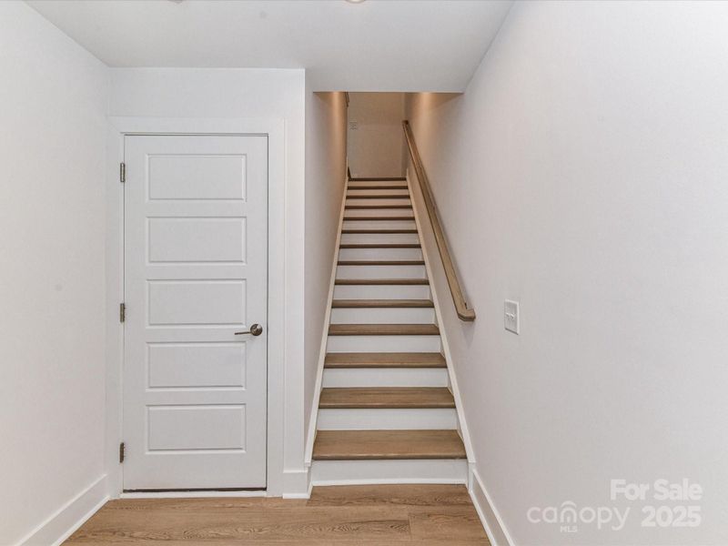 First Floor Foyer with Garage and Front Door Entry.