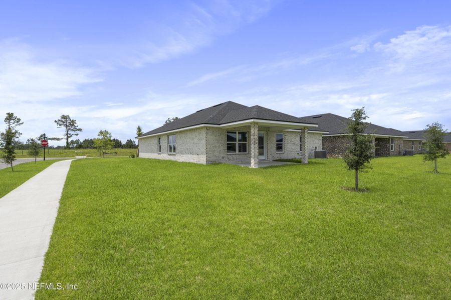 Front exterior of a new home in Shadow Crest at Rolling Hills, Green Cove Springs, FL, highlighting curb appeal (Image 16). Front exterior of a new home in Shadow Crest at Rolling Hills, Green Cove Springs, FL, highlighting curb appeal (Image 16).