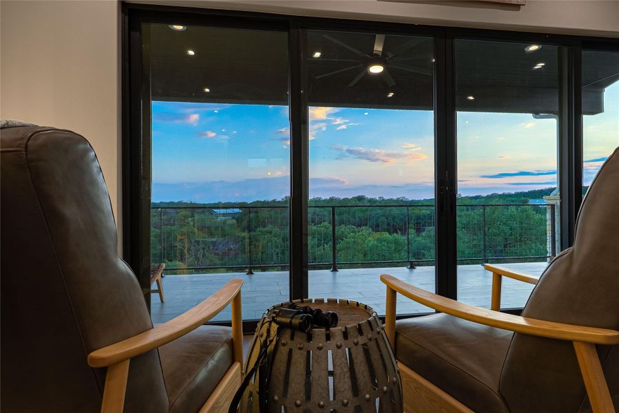 Vaulted design and lakefront backdrop define this inviting living room.