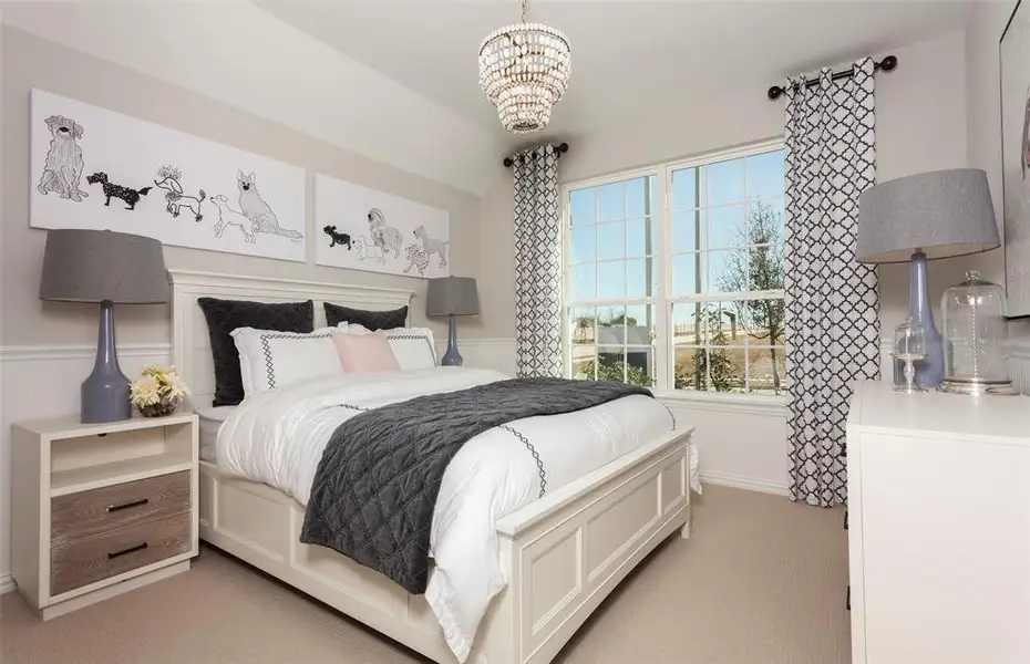 Comfortable secondary bedroom with generous closet space *Model representation