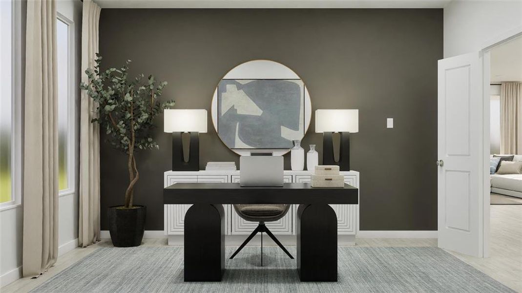 Home office featuring light wood-style floors Home office featuring light wood-style floors