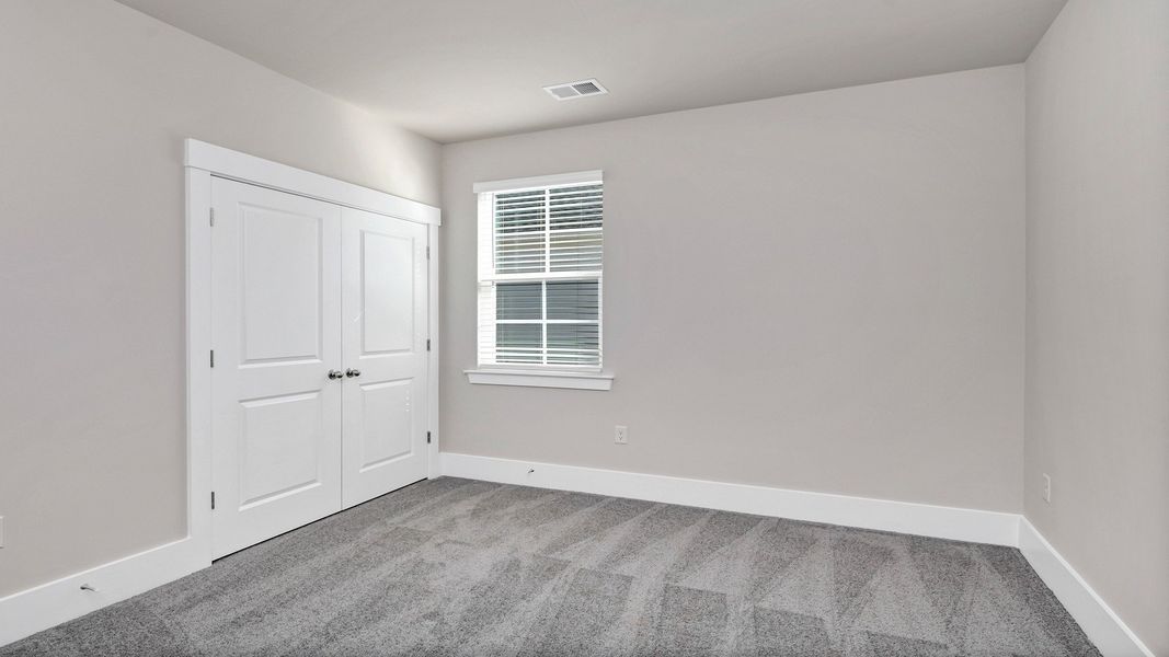 Representative unfurnished interior of a home built from the Litchfield by D.R. Horton in Lake Tide Summit, Chapin (Image 25).