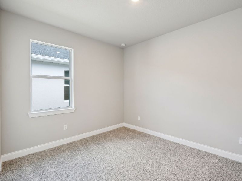 Bedroom in the Onyx floorplan at 6406 NW Sweetwood Drive