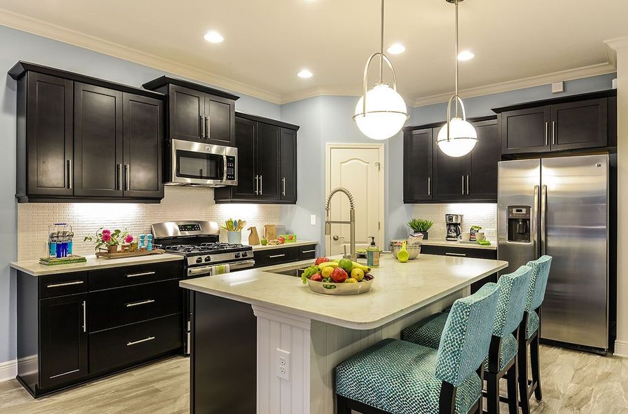 Representative furnished interior of a home built from the Meadow Brook by Neal Communities in Verandah, Fort Myers (Image 5).