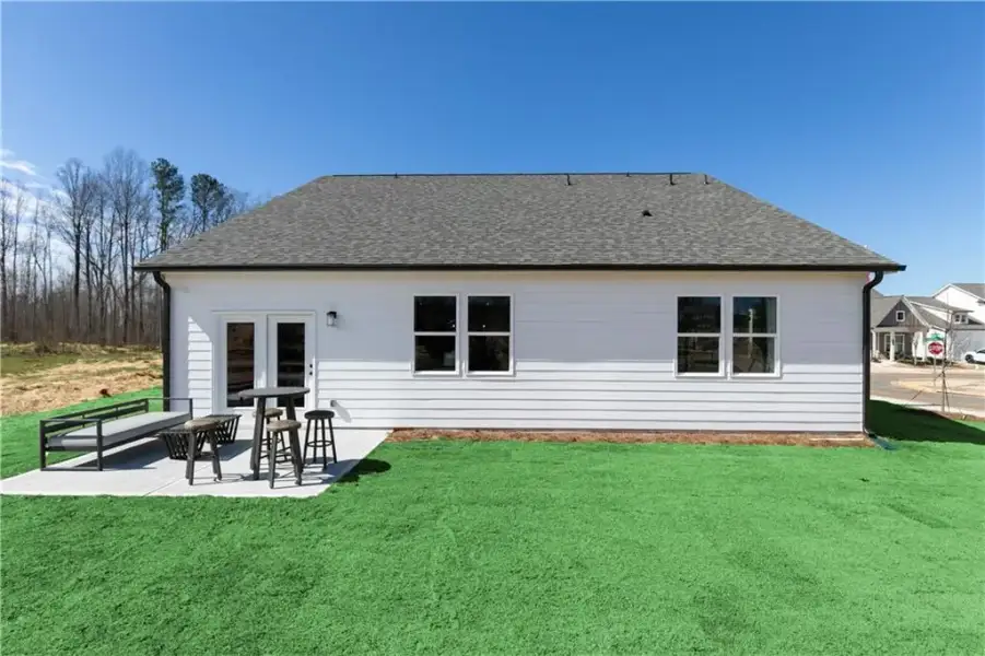 Exterior details and patio area of a home in Madison at Buice Lake, Acworth (Image 20).