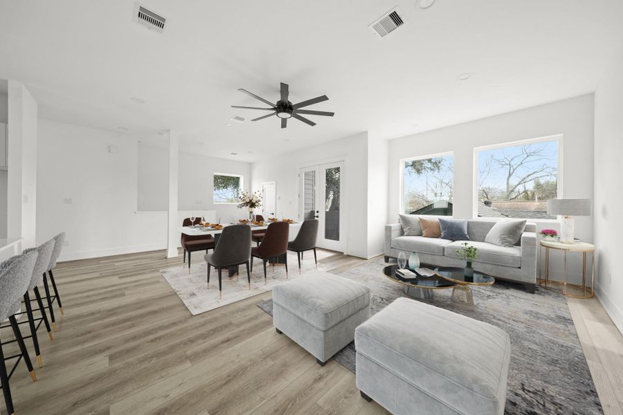 Imagine relaxing or entertaining family and friends in the family room with picture windows, recessed lights and a ceiling fan with integrated light, offering numerous furniture placement opportunities. This photo has been virtually staged. Imagine relaxing or entertaining family and friends in the family room with picture windows, recessed lights and a ceiling fan with integrated light, offering numerous furniture placement opportunities. This photo has been virtually staged.